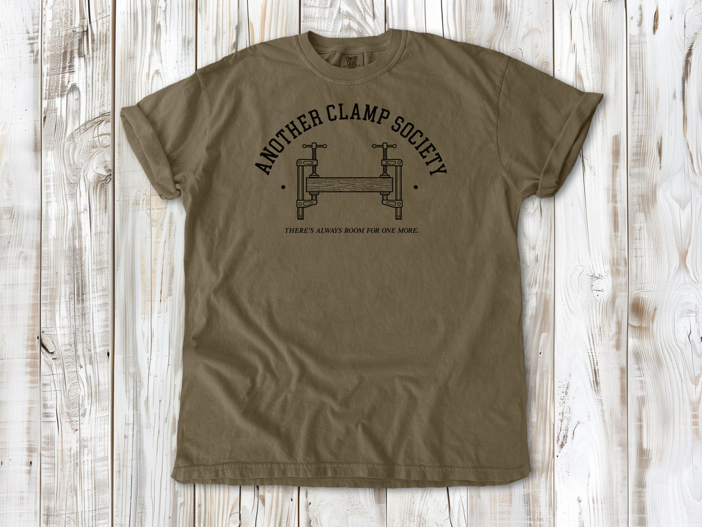 Khaki garment-dyed tee with Another Clamp Society woodworking tools graphic.