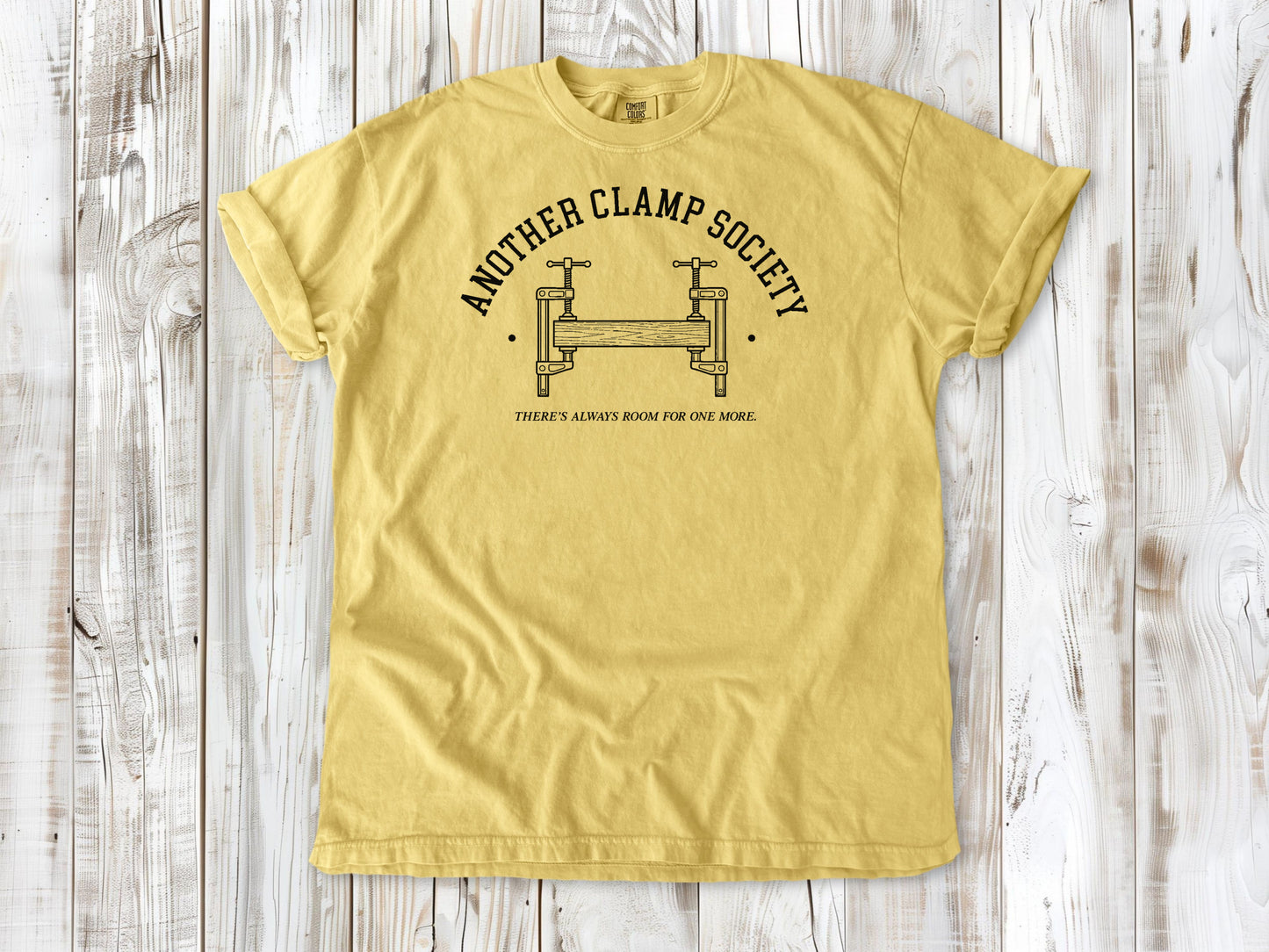 Butter garment-dyed tee with Another Clamp Society woodworking tools graphic.