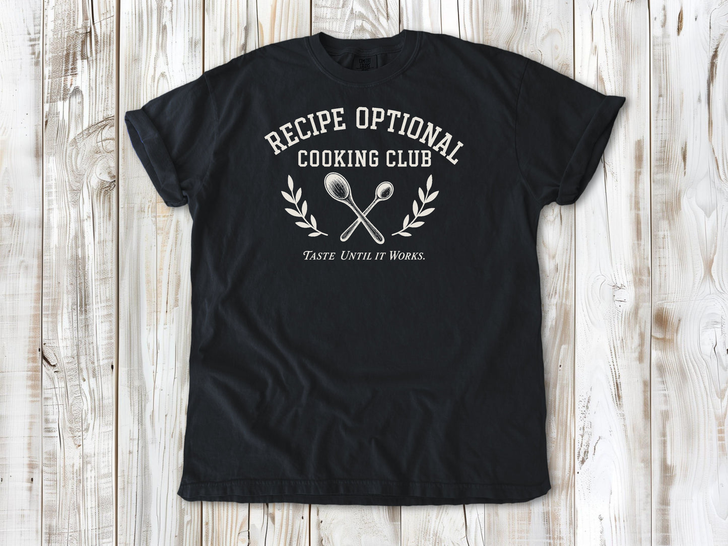 Graphite garment-dyed tee with Recipe Optional Cooking Club kitchen graphic.