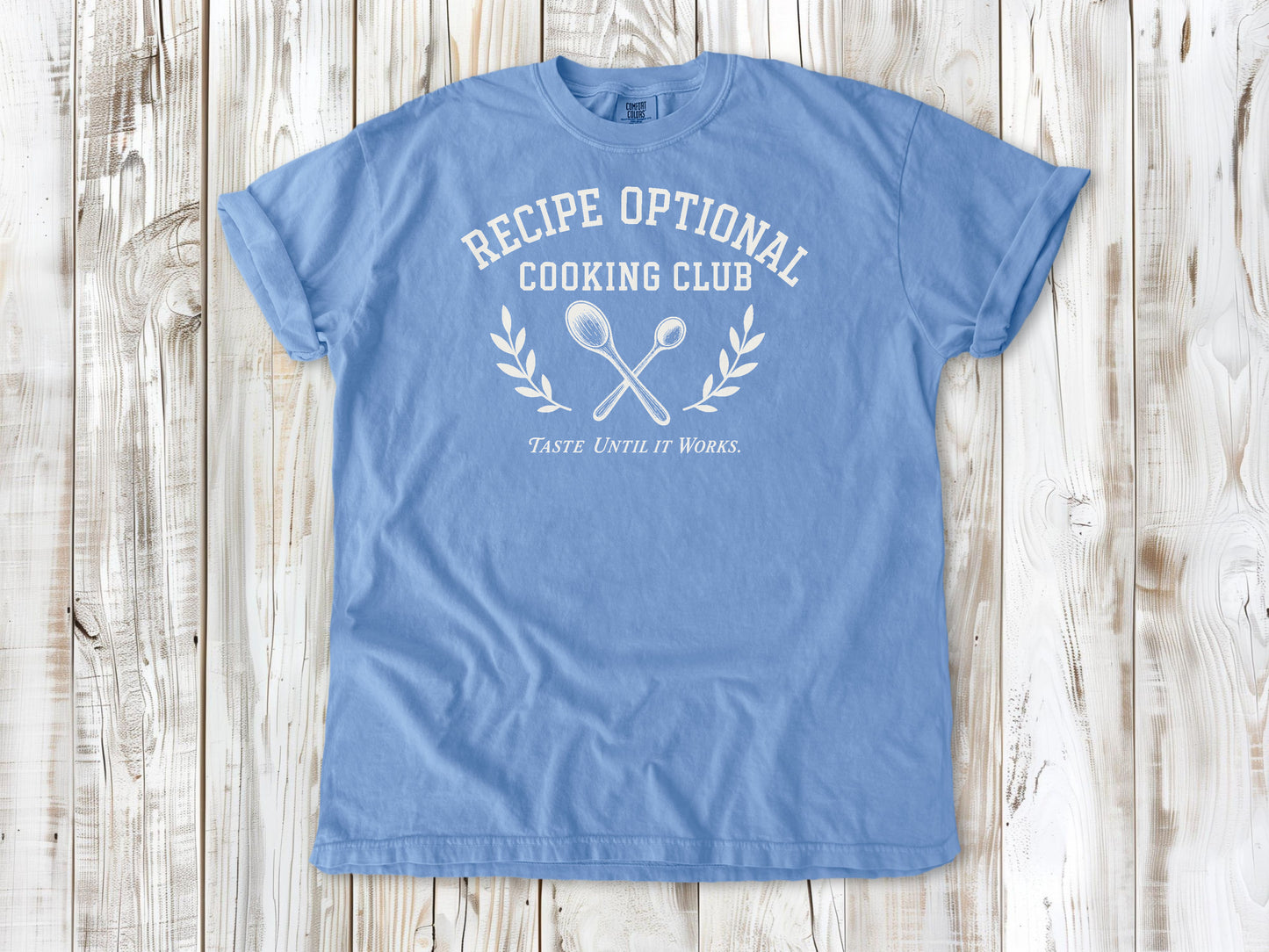 Washed Denim garment-dyed tee with Recipe Optional Cooking Club kitchen graphic.