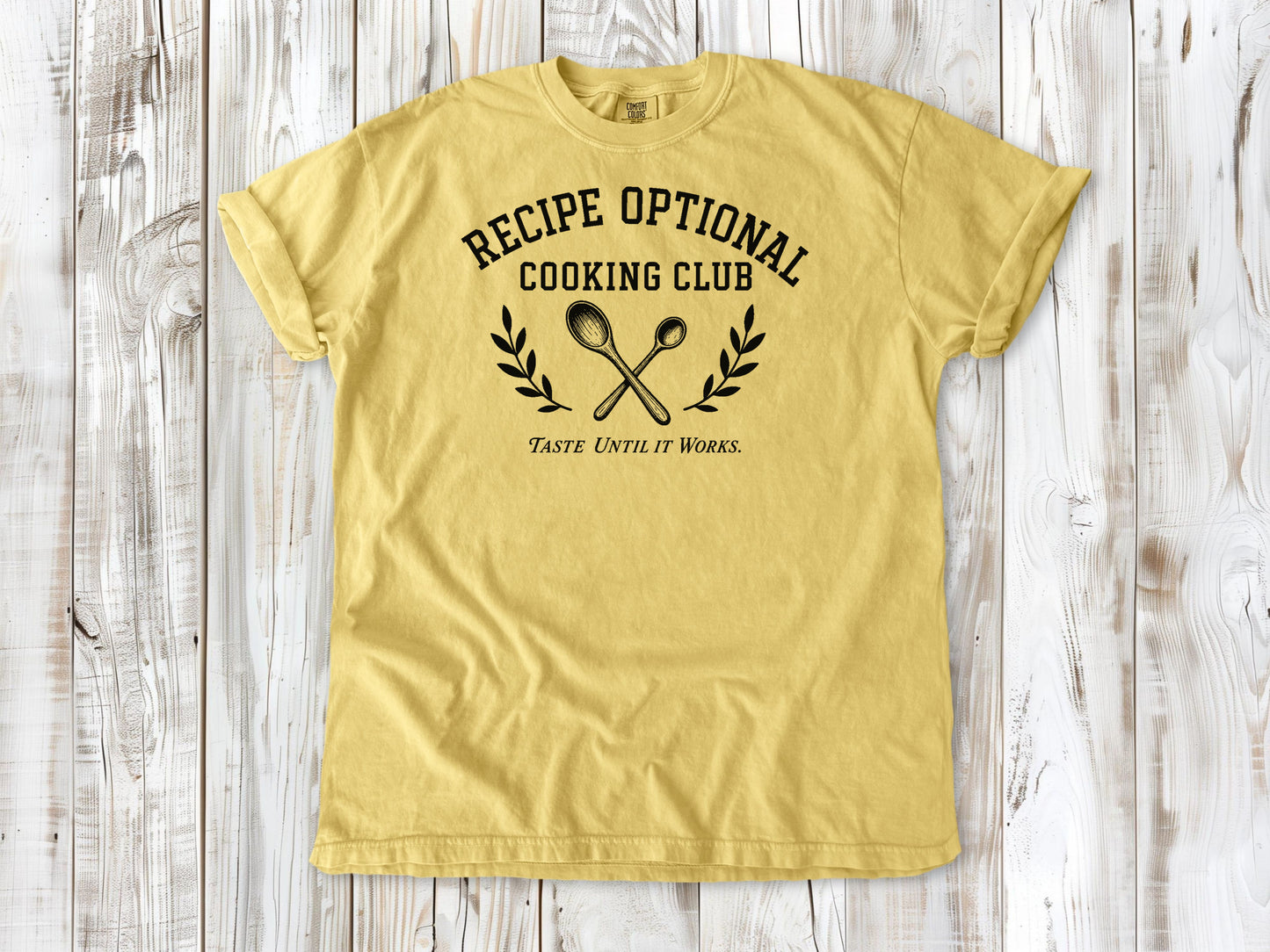 Butter garment-dyed tee with Recipe Optional Cooking Club kitchen graphic.