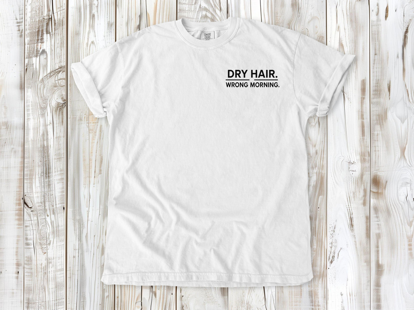 White garment-dyed tee with Dry Hair Wrong Morning small left-chest surf graphic.
