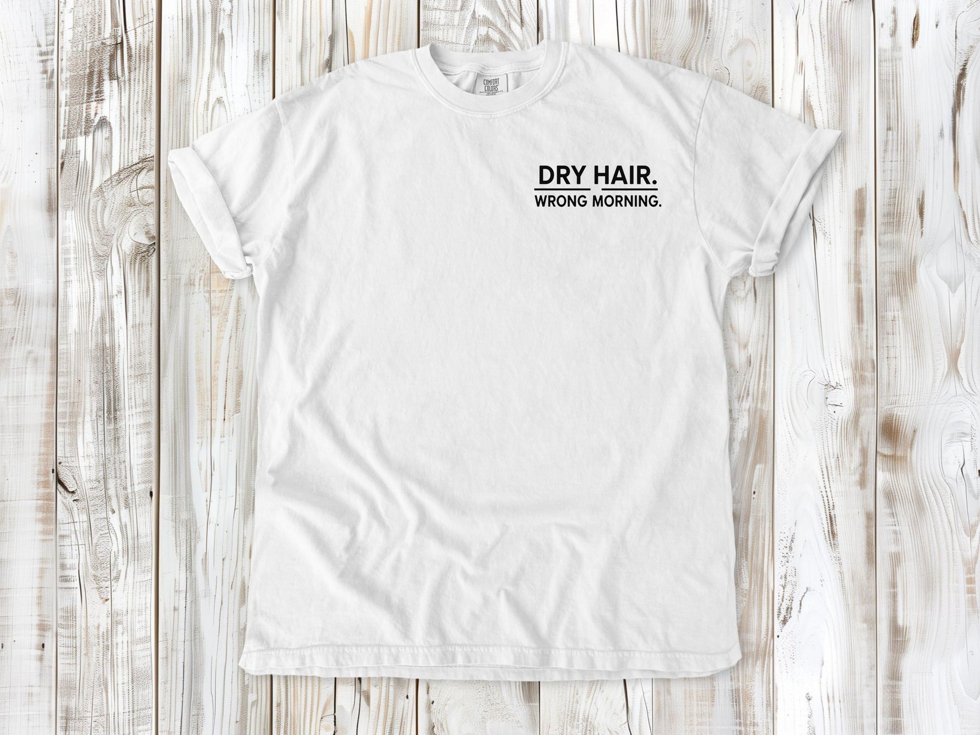 White garment-dyed tee with Dry Hair Wrong Morning small left-chest surf graphic.