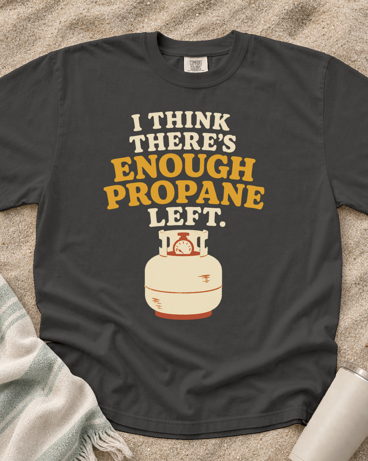 Pepper garment-dyed tee with I Think There’s Enough Propane Left griddle graphic.