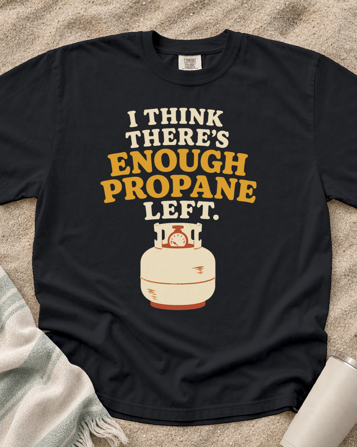 Graphite garment-dyed tee with I Think There’s Enough Propane Left griddle graphic.