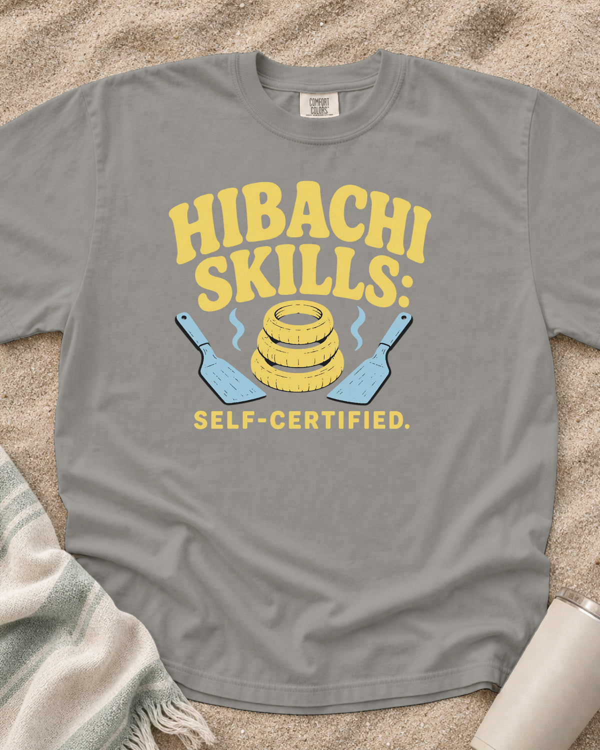 Grey garment-dyed tee with Hibachi Skills Self-Certified griddle graphic.