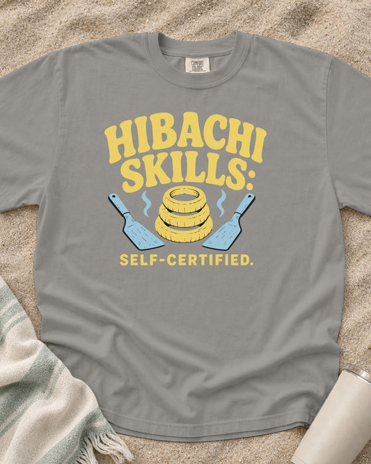 Grey garment-dyed tee with Hibachi Skills Self-Certified griddle graphic.