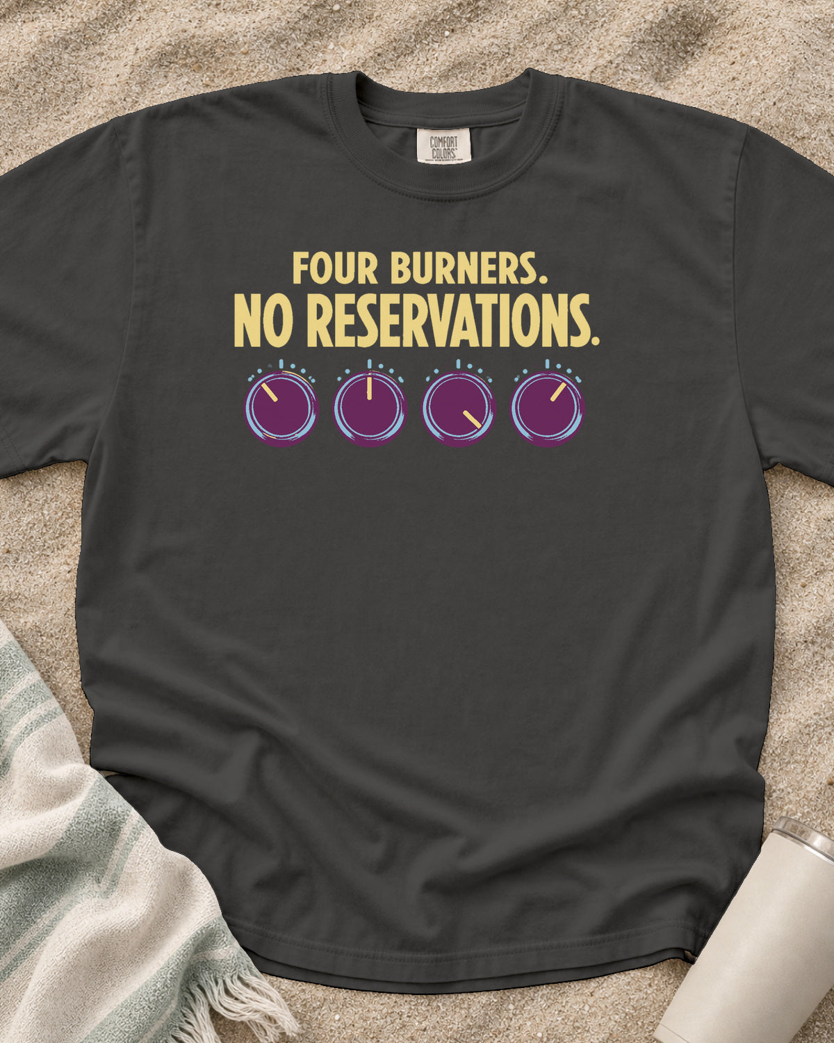 Pepper garment-dyed tee with Four Burners No Reservations griddle graphic.