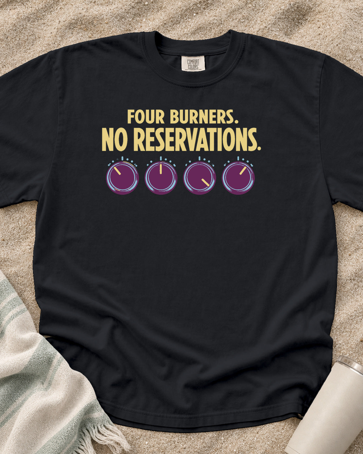 Graphite garment-dyed tee with Four Burners No Reservations griddle graphic.