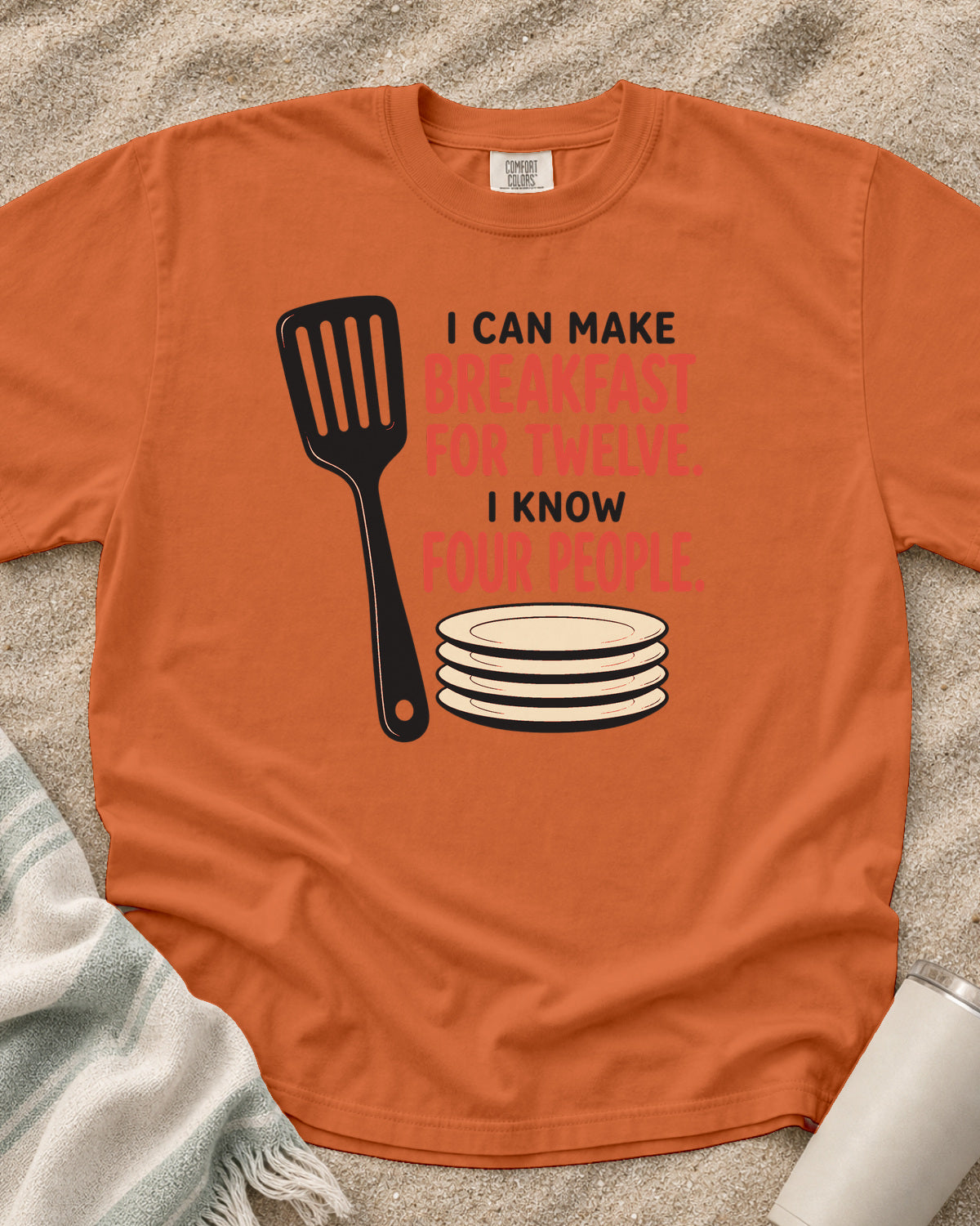 Burnt Orange garment-dyed tee with I Can Make Breakfast for Twelve griddle graphic.