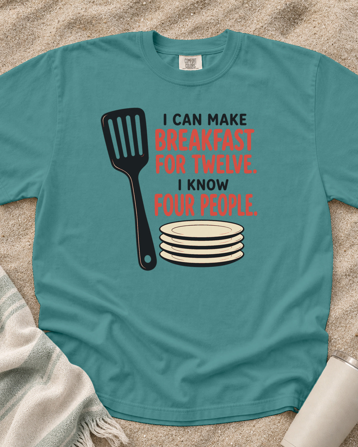 Seafoam garment-dyed tee with I Can Make Breakfast for Twelve griddle graphic.