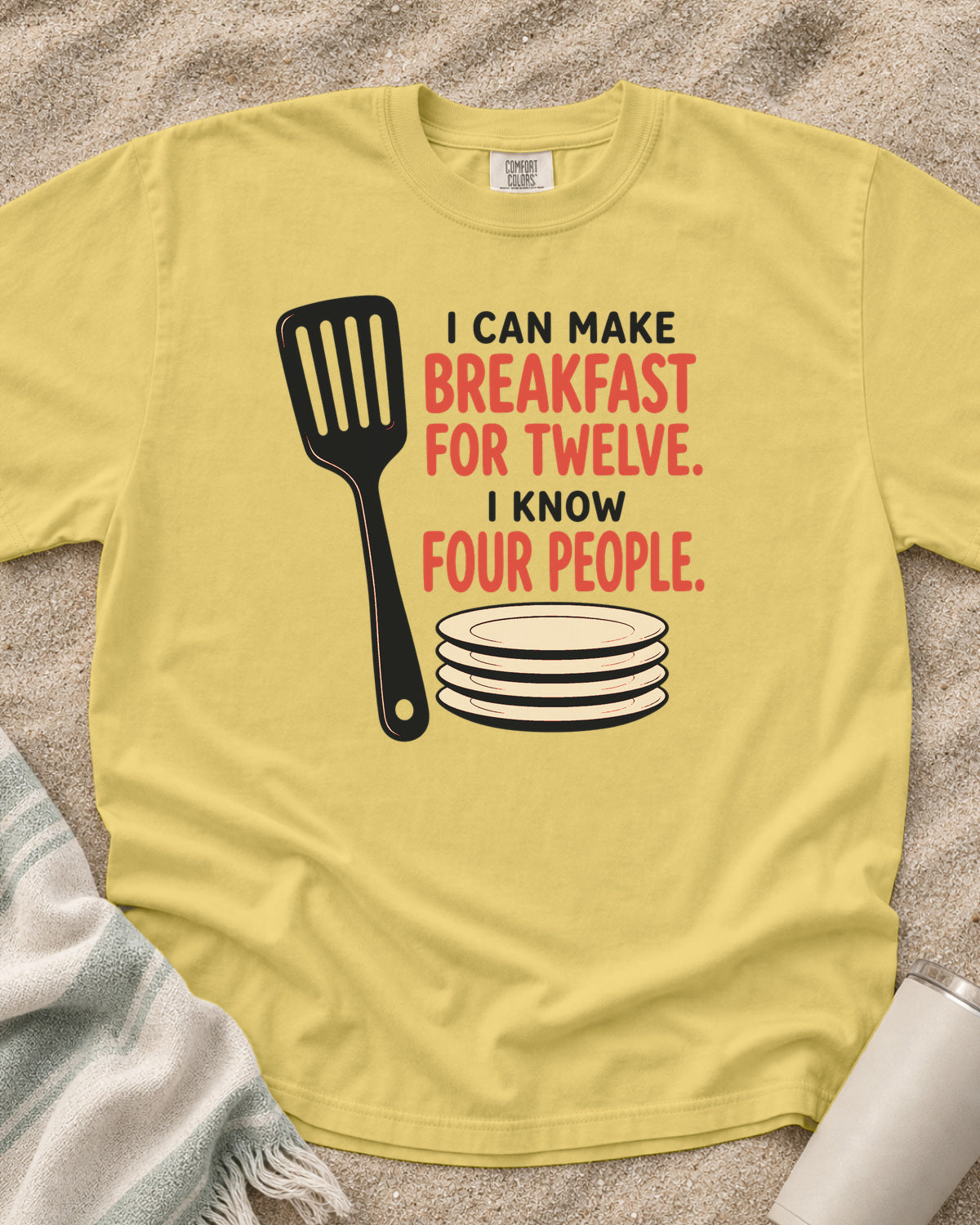 Butter garment-dyed tee with I Can Make Breakfast for Twelve griddle graphic.
