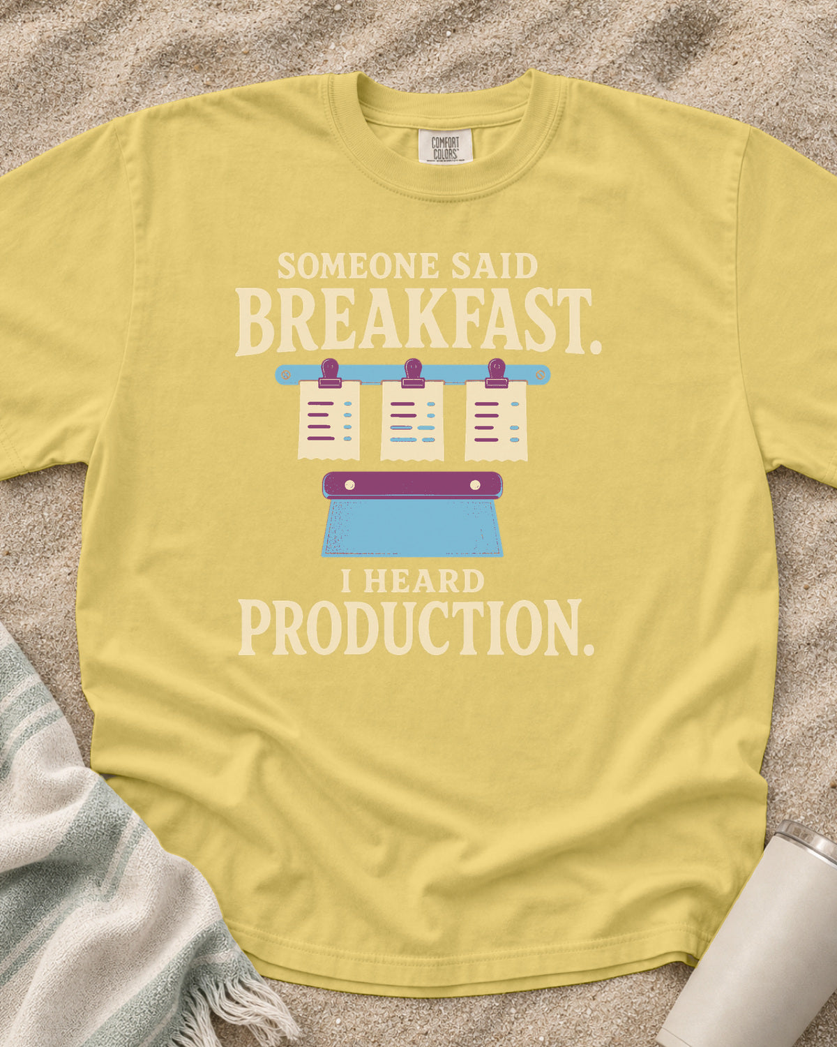 Butter garment-dyed tee with Someone Said Breakfast I Heard Production graphic.