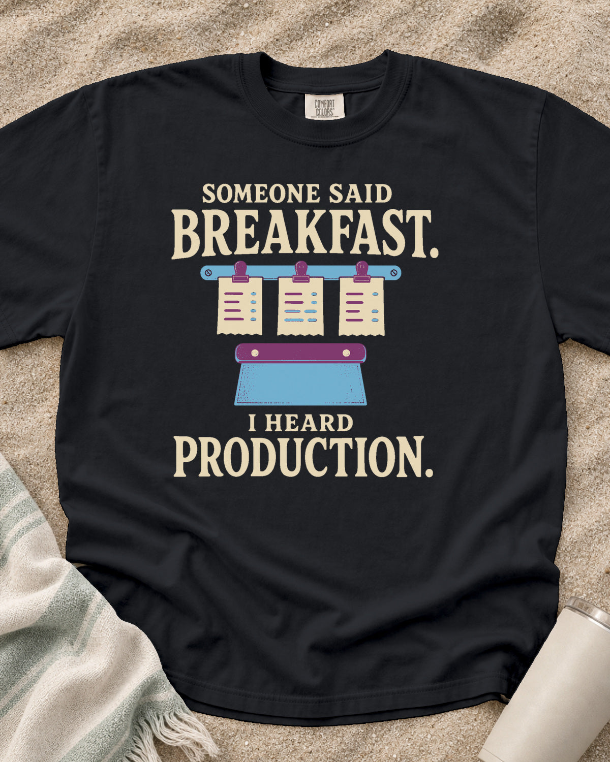 Graphite garment-dyed tee with Someone Said Breakfast I Heard Production graphic.