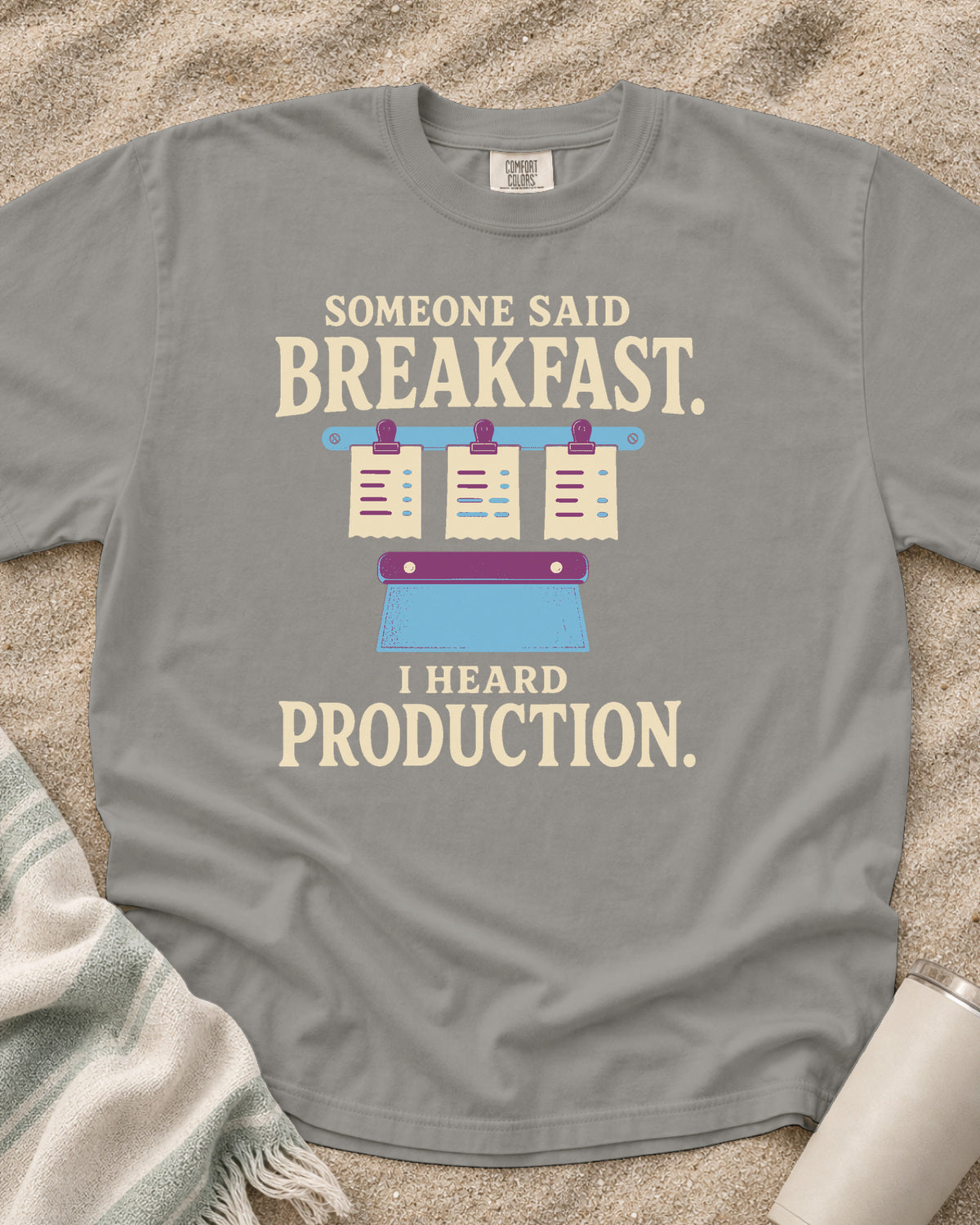Grey garment-dyed tee with Someone Said Breakfast I Heard Production graphic.