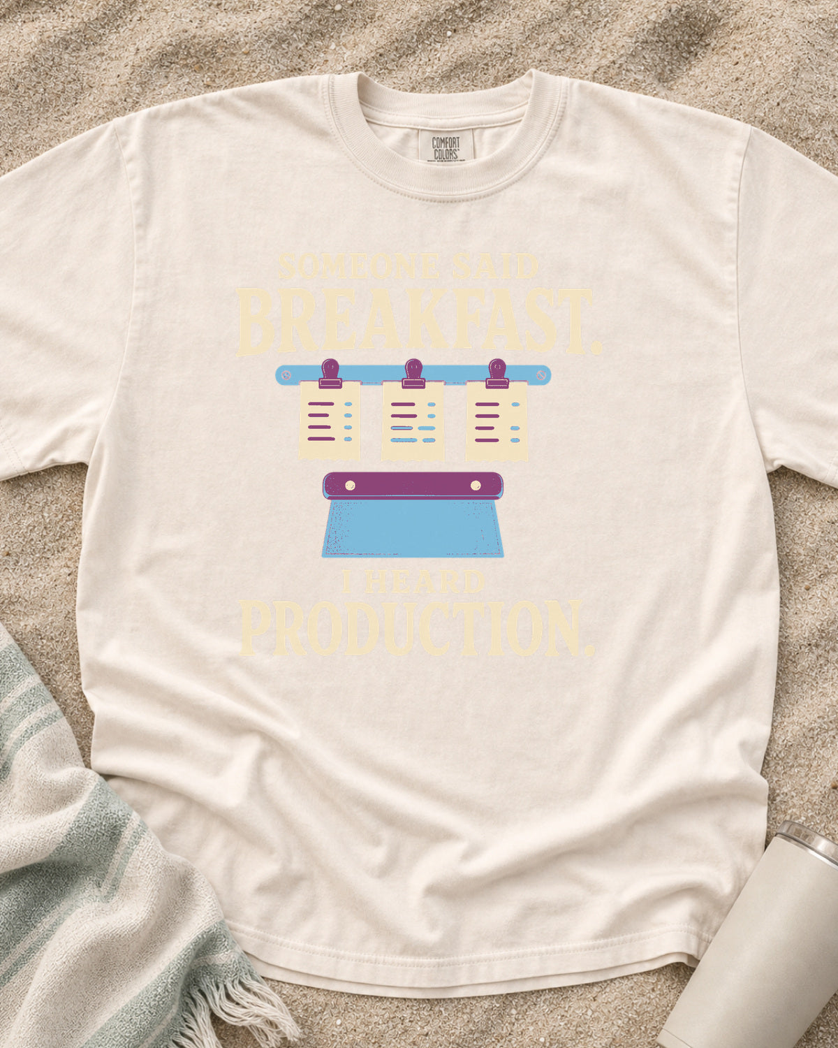 Ivory garment-dyed tee with Someone Said Breakfast I Heard Production graphic.