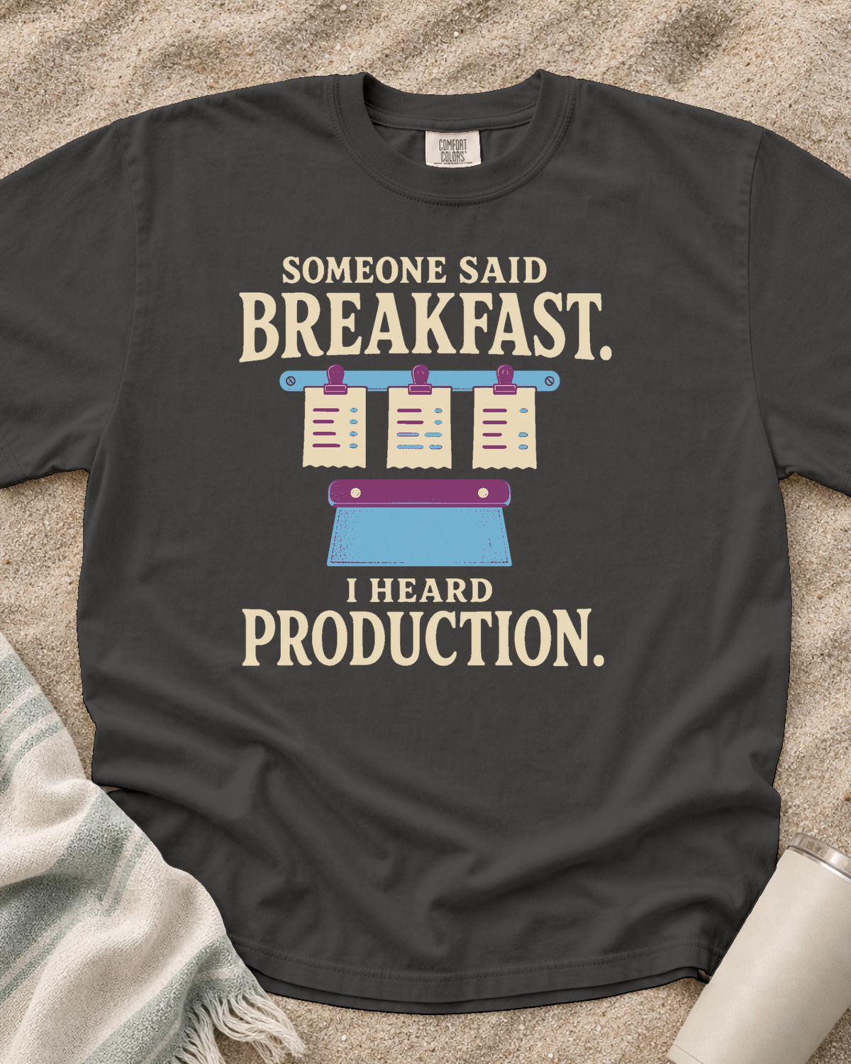 Pepper garment-dyed tee with Someone Said Breakfast I Heard Production graphic.