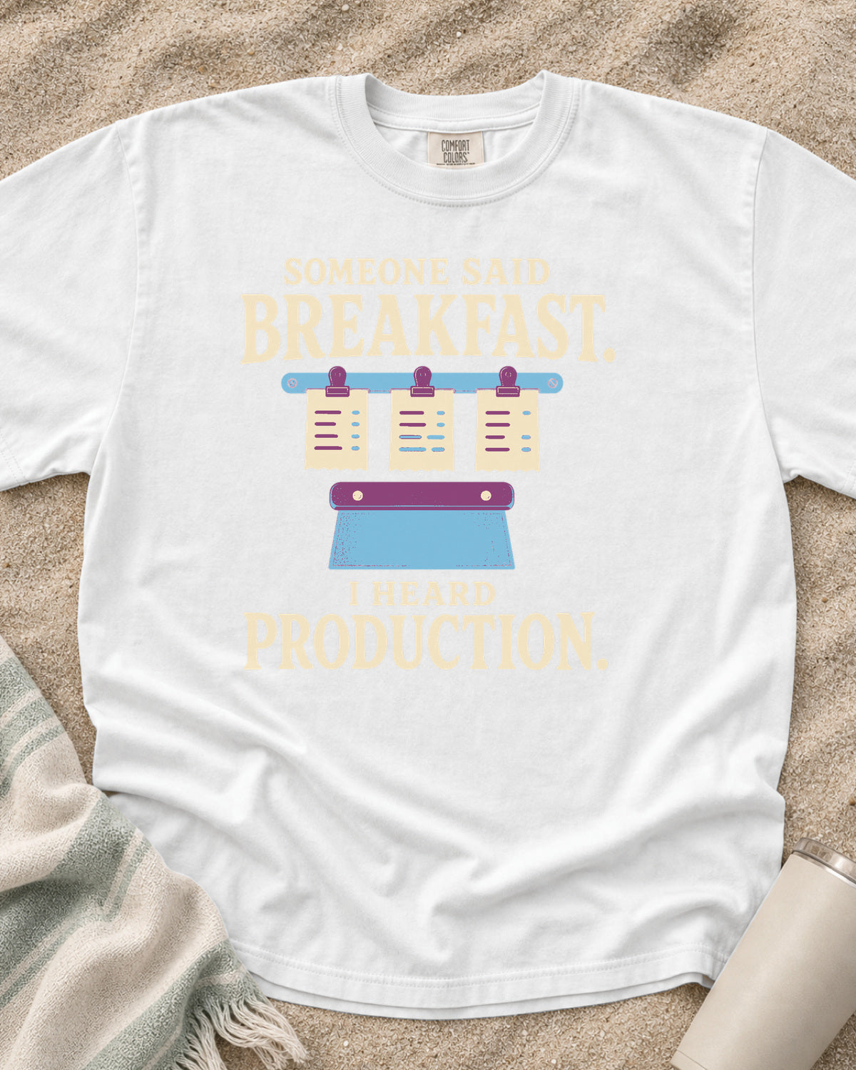 White garment-dyed tee with Someone Said Breakfast I Heard Production graphic.