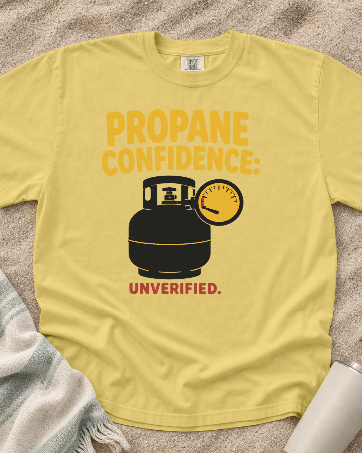 Butter garment-dyed tee with Propane Confidence Unverified griddle graphic.