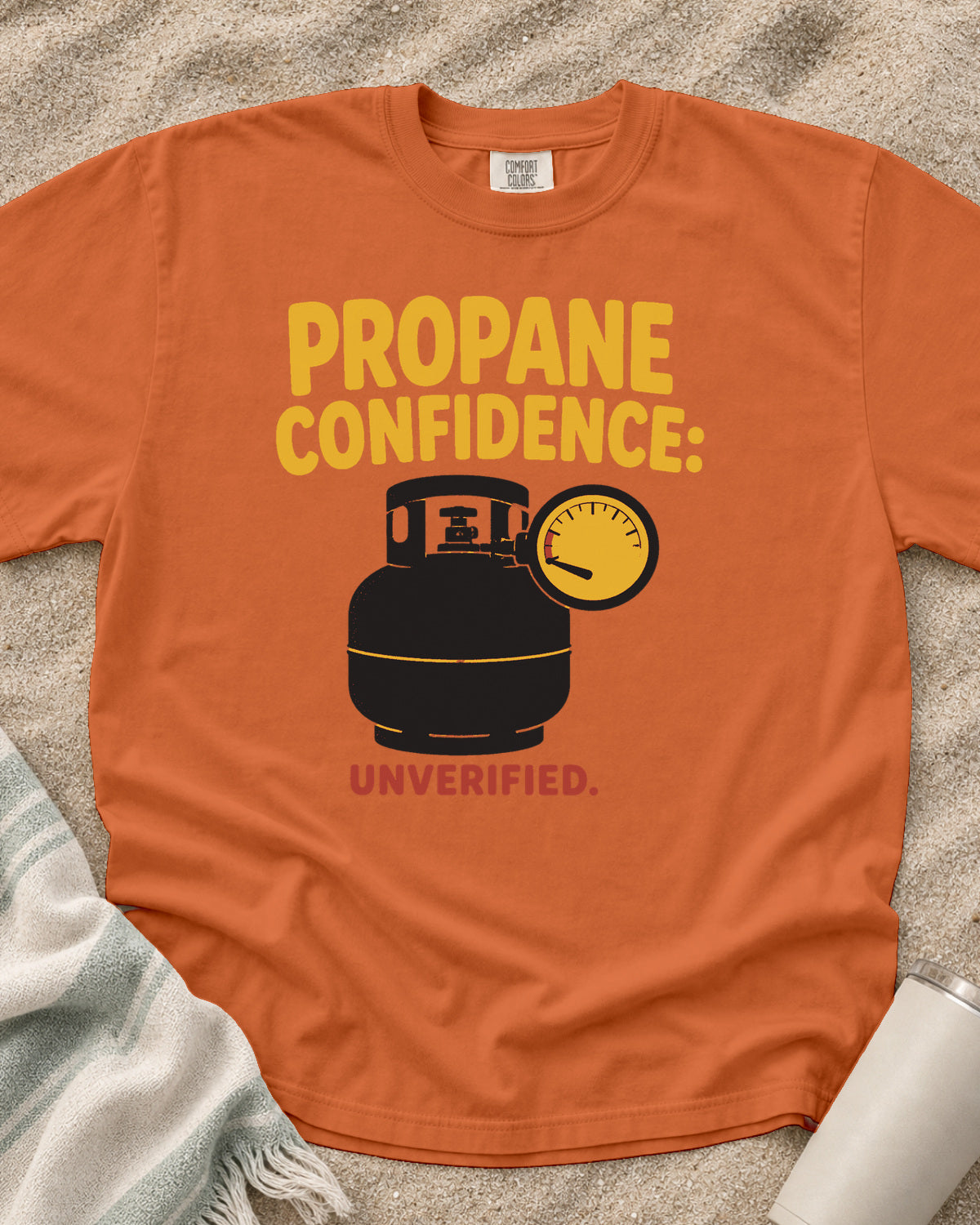 Burnt Orange garment-dyed tee with Propane Confidence Unverified griddle graphic.