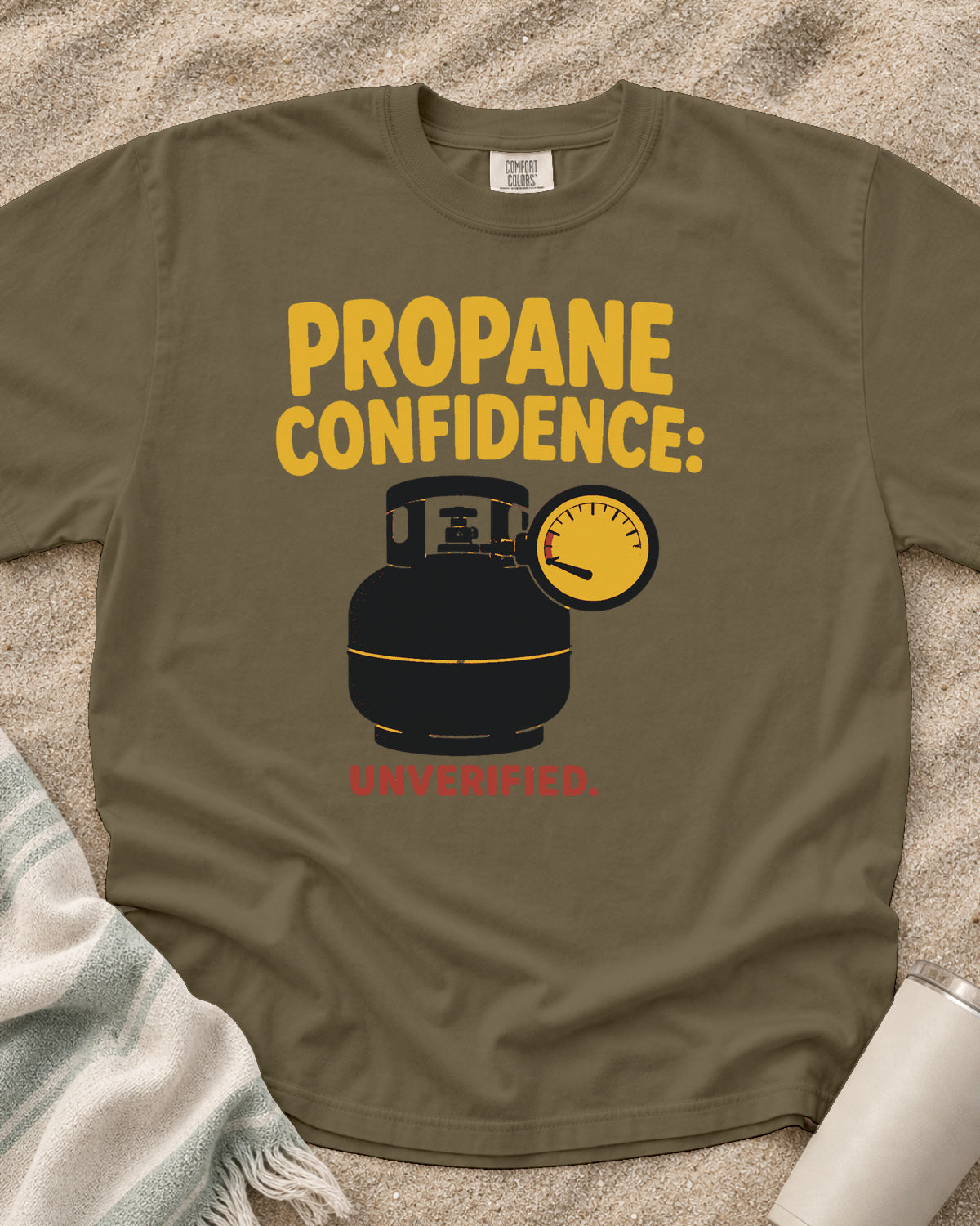 Khaki garment-dyed tee with Propane Confidence Unverified griddle graphic.