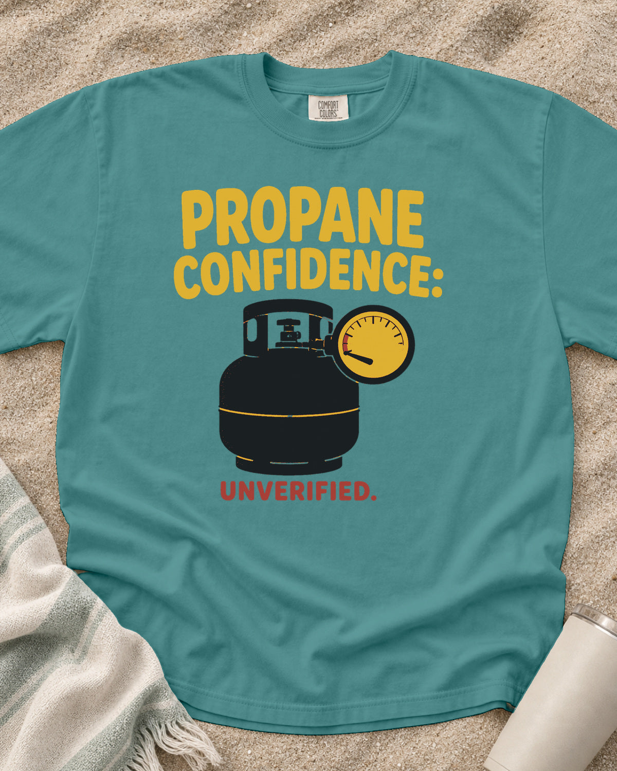 Seafoam garment-dyed tee with Propane Confidence Unverified griddle graphic.