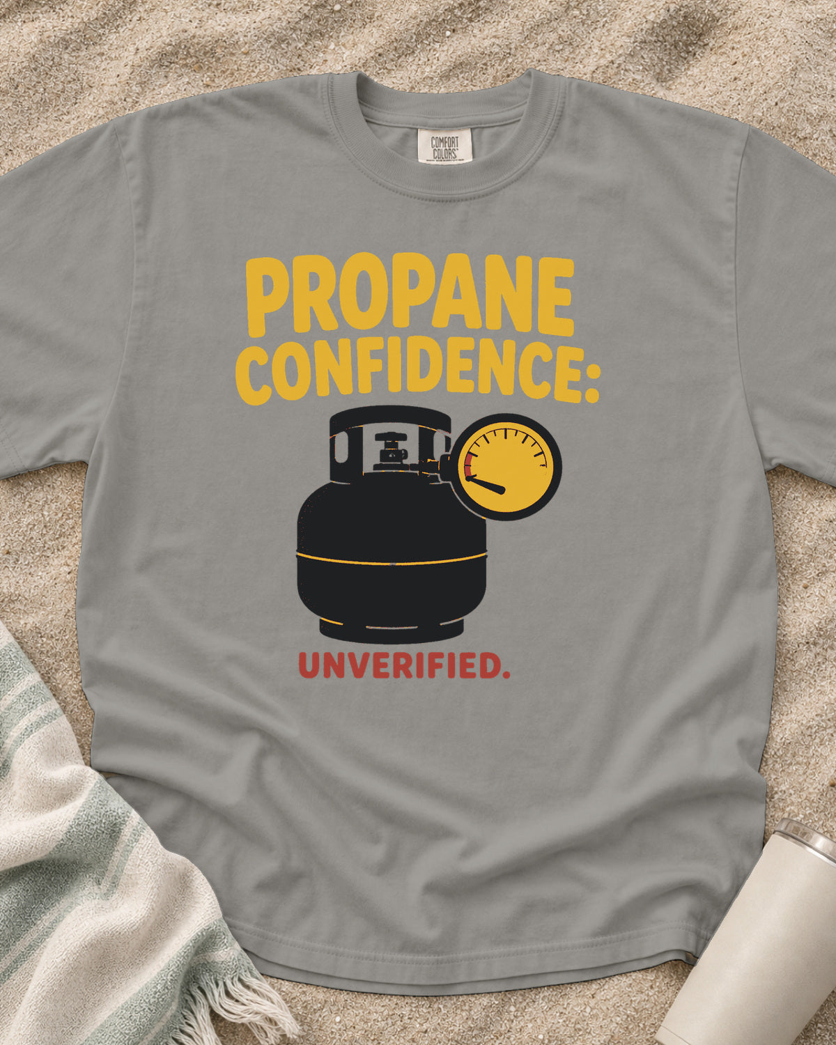 Grey garment-dyed tee with Propane Confidence Unverified griddle graphic.