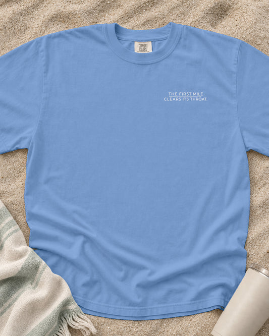 Washed Denim Comfort Colors 1717 tee with The First Mile Clears Its Throat graphic.