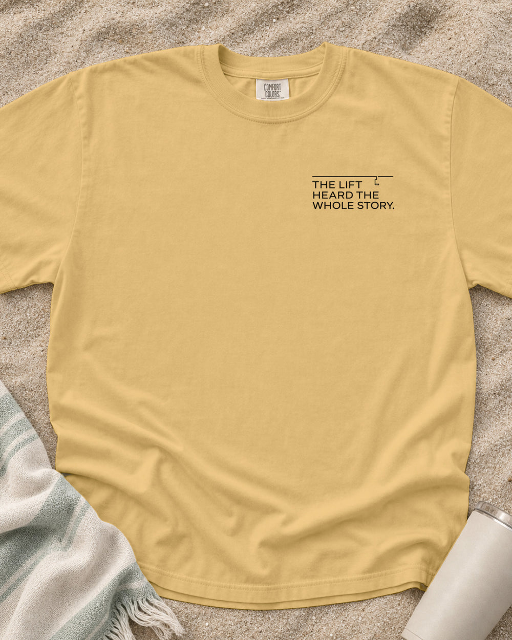 Mustard Comfort Colors 1717 tee with The Lift Heard the Whole Story graphic.