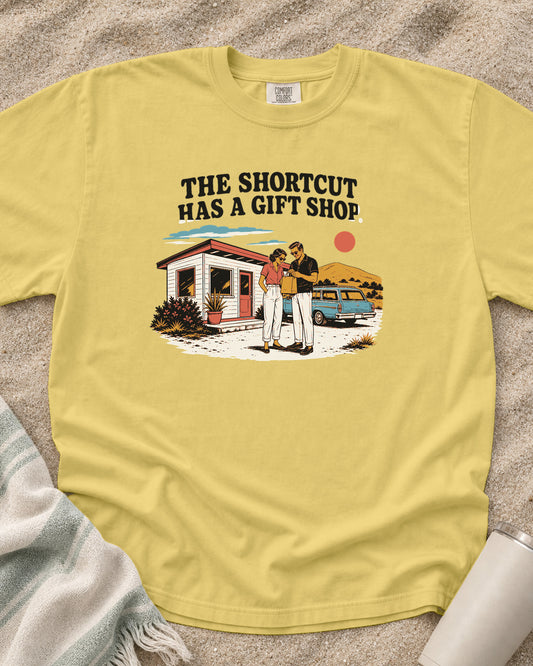 Butter Comfort Colors 1717 tee with The Shortcut Has a Gift Shop graphic.