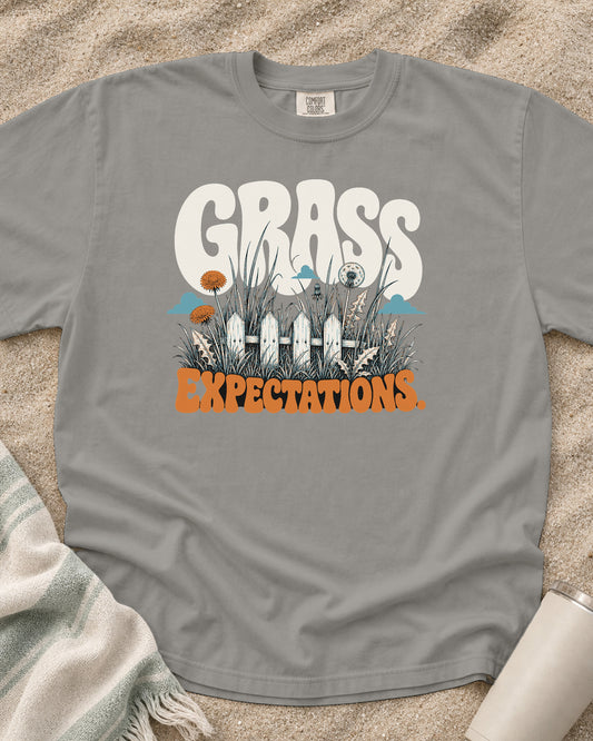Grey Comfort Colors 1717 tee with Grass Expectations graphic.