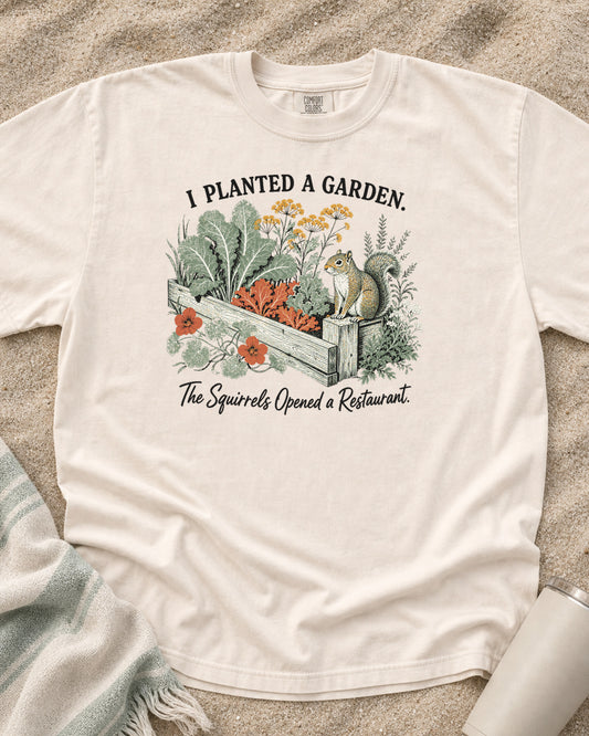 Ivory Comfort Colors 1717 tee with I Planted a Garden. The Squirrels Opened a Restaurant graphic.
