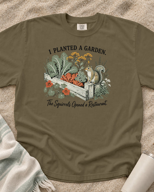 Khaki Comfort Colors 1717 tee with I Planted a Garden. The Squirrels Opened a Restaurant graphic.