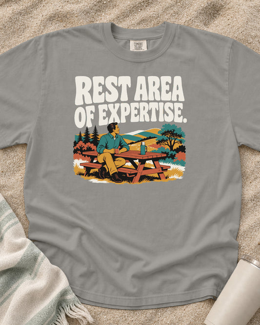 Grey Comfort Colors 1717 tee with Rest Area of Expertise graphic.
