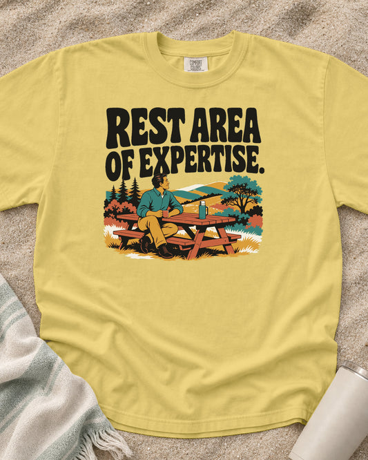 Butter Comfort Colors 1717 tee with Rest Area of Expertise graphic.