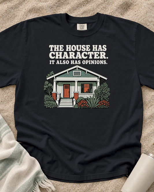 Graphite Comfort Colors 1717 tee with The House Has Character. It Also Has Opinions graphic.