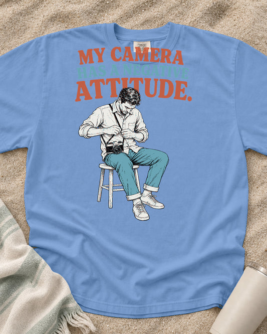 Washed Denim Comfort Colors 1717 tee with My Camera Has a Negative Attitude graphic.