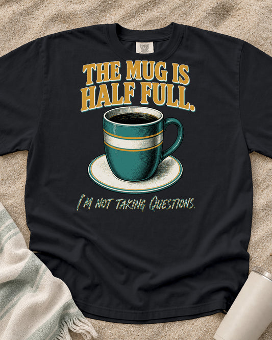 Graphite Comfort Colors 1717 tee with The Mug Is Half Full. I'm Not Taking Questions graphic.