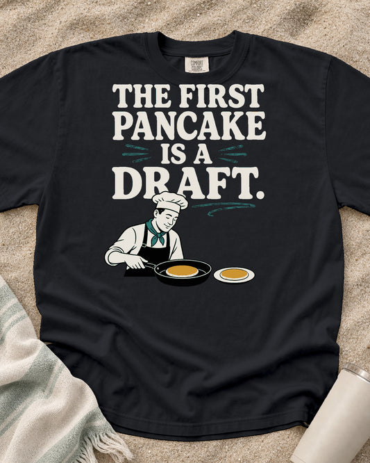 Graphite Comfort Colors 1717 tee with The First Pancake Is a Draft graphic.